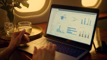 Closeup hands touching pad. Business manager analyzing charts on laptop screen. 