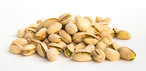 roasted pistachios on white background
