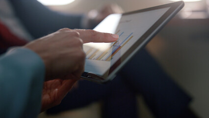 Businesswoman hands holding tablet computer closeup. Partners checking diagram
