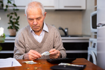 desperate old man pensioner counting his last money