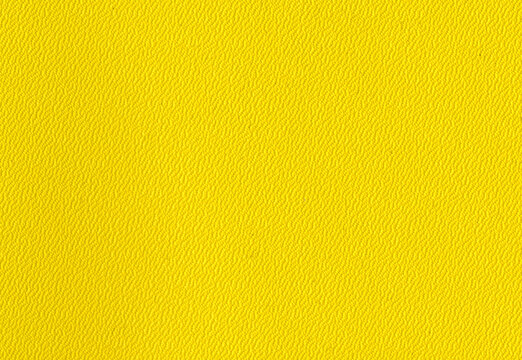 High detail large image close up bright yellow plastic binder back cover paper texture background scan fine grain mesh with small dots pattern for mockup or high res wallpaper with copyspace for text