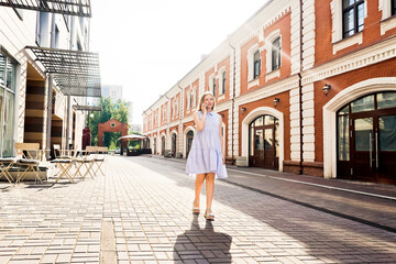Young woman talking on mobile phone outdoors.