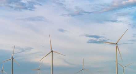 Fototapeta premium Panoramic image Wind turbine generator with blue sky - Energy Conservation Concept Thailand