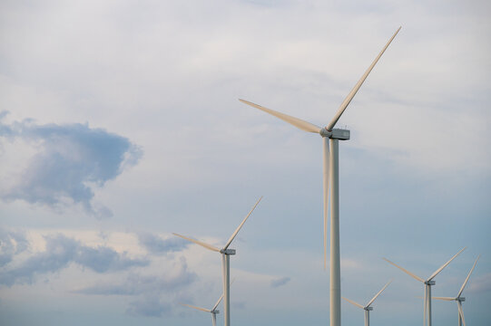 Wind turbine generator with blue sky - energy conservation concept. thailand