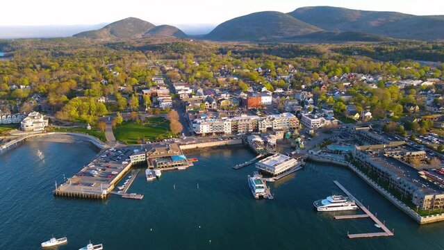 Bar Harbor historic town center aerial view at sunset, with Cadillac Mountain in Acadia National Park at the background, Bar Harbor, Maine ME, USA. 