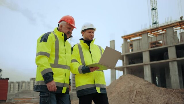civil engineers are inspecting new object in building area of modern residential complex