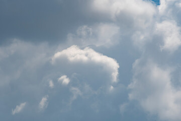 Naklejka na ściany i meble Background with closeup of white cumulus cloud