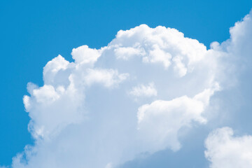 Naklejka na ściany i meble Background with closeup of white cumulus cloud