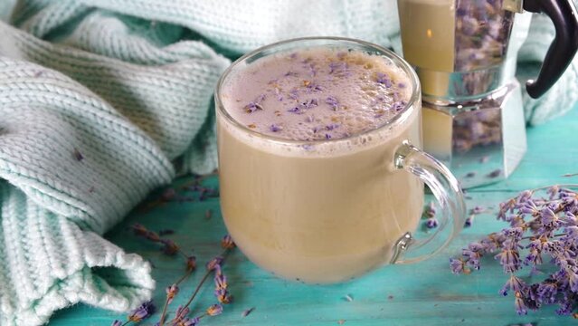 Cup of cappuccino raf coffee with lavender syrup. Aromatic lavandula infused latte coffee hot drink 