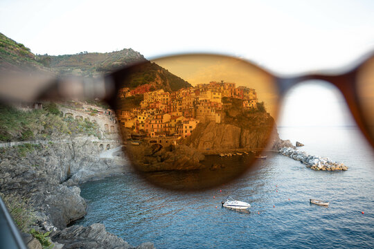 Looking trough Sunglasses at Manarola, famous Town in 5 terre, Italy.