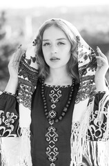 Portrait of a beautiful blonde in traditional national clothes.