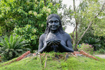 statue of an earth mother in a park