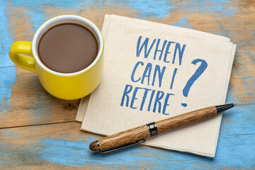 When can I retire? Retirement planning question on napkin with a cup of coffee. Personal finance concept.