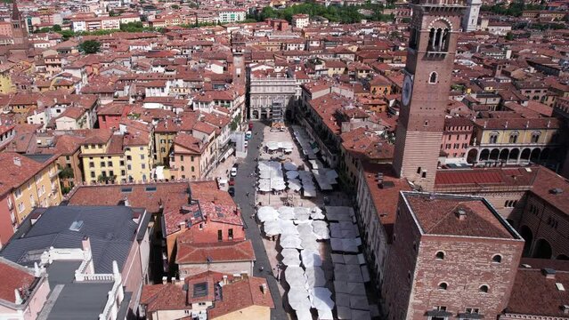 Verona, Italy. Aerial View of Piazza Delle Erbe, Torre Dei Lamberti Bell Tower. Old Italian Town Buildings on Sunny Summer Day, Drone Shot