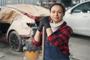 Portrait of young mechanic that looking at camera