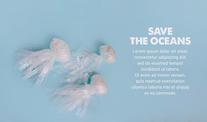 Sea and ocean life from waste. Jellyfishes out of plastic waste on blue background. Pollution of...