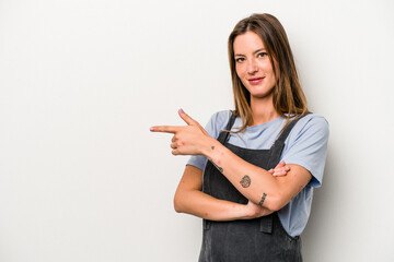 Young caucasian pregnant woman isolated on white background smiling cheerfully pointing with forefinger away.