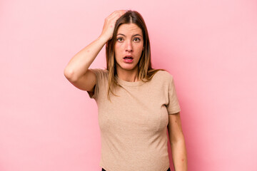Young caucasian pregnant woman isolated on white background being shocked, she has remembered important meeting.