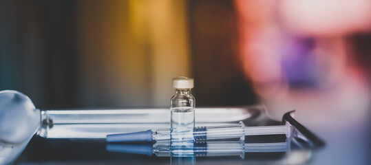 vial vaccine for vaccincination and injection hypodermic syring.medication use for prevention disease virus and flu shot concpet.