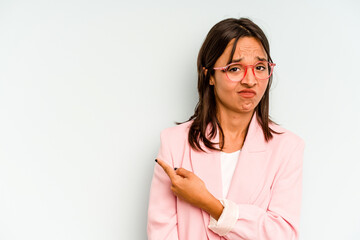 Young hispanic woman isolated on blue background keeping two arms crossed, denial concept.