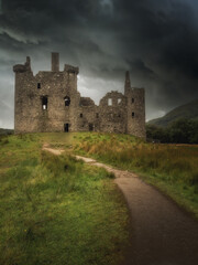 Fototapeta na wymiar Vertical pic of an ld scottisch castle in the highlands