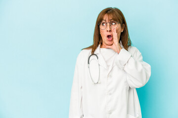 Middle age doctor woman isolated on pink background is saying a secret hot braking news and looking aside