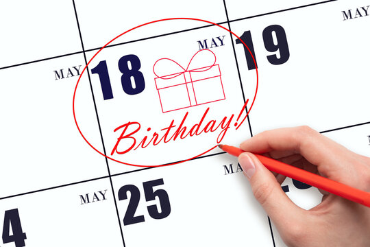 The hand circles the date on the calendar 18 May, draws a gift box and writes the text Birthday. Holiday.