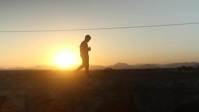 Silhouette of a Children walking in the countryside of Brazil