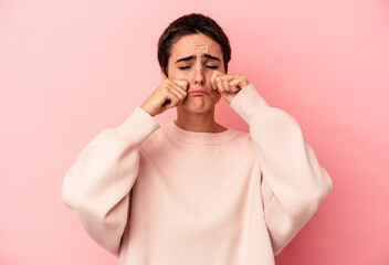 Obraz premium Young caucasian woman isolated on blue background whining and crying disconsolately.