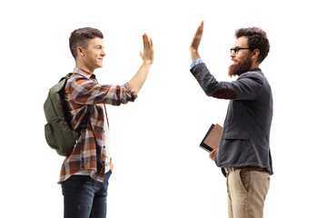 Student gesturing high-five with a teacher