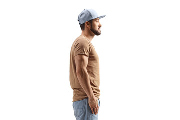 Profile shot of a guy with a cap standing