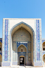 Fototapeta na wymiar Exterior of the Ulugbek Madrasa in Bukhara. The oldest Madrasa in Central Asia founded in 15th Century and UNESCO World Heritage Site in Uzbekistan, Central Asia