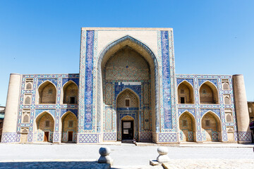 Fototapeta na wymiar Exterior of the Ulugbek Madrasa in Bukhara. The oldest Madrasa in Central Asia founded in 15th Century and UNESCO World Heritage Site in Uzbekistan, Central Asia