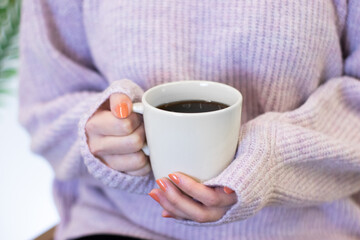 filter coffee in white mug, woman holding in hand