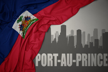 abstract silhouette of the city with text Port-au-Prince near waving national flag of haiti on a gray background. 3D illustration