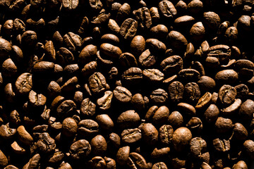 Roasted coffee beans, medium roasted coffee beans as background