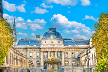 Facade view of Palais de Justice building behind fence. Paris, France