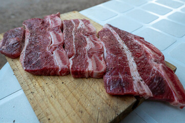 Typical Uruguayan and Argentine Asado Cooked on fire. Entrana and Vacio meat cuts. Accompanied with Chorizo