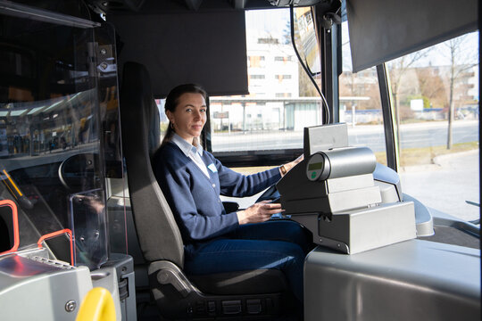 Woman Bus Driver Is In The Working City