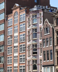 Fototapeta na wymiar Amsterdam Nieuwezijds Voorburgwal Street Modern and Historic Building Facades, Netherlands