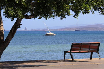 A small sailboat stranded in the bay of La Paz