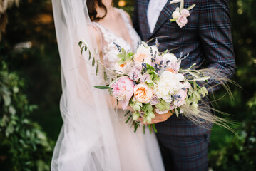 wedding bouquet of the bride, boho style, outdoor, dry flowers