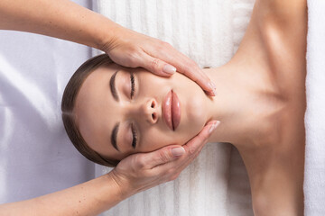 Fototapeta na wymiar Woman at face massage