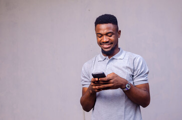 Portrait of handsome excited cheerful joyful delightful curious guy wearing casual sending and...