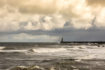 Looking across King Edwards Bay at the rough seas on a cloudy day at Tynemouth, England