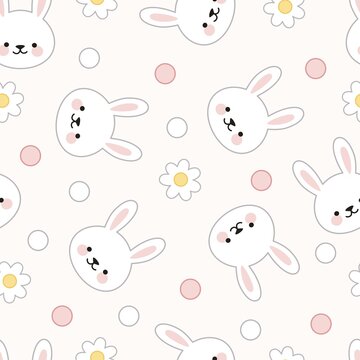 Seamless pattern of bunny faces, flowers and dots on a pink background.