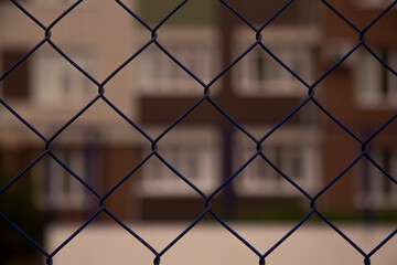 Fototapeta premium Blurred background behind metal bars. Closed. Ban