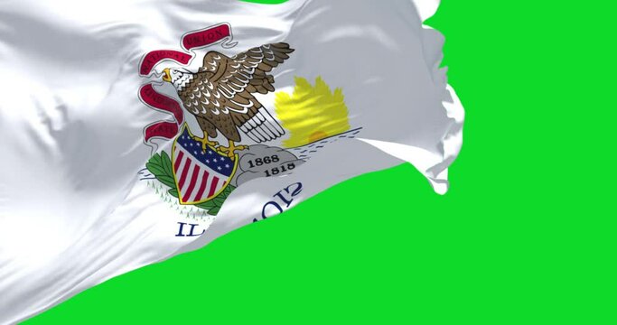 The US state flag of Illinois waving in the wind isolated on a green background.