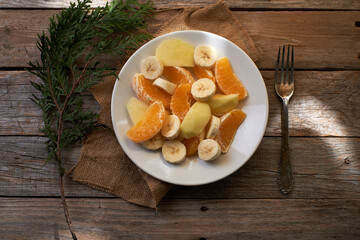 Fruit salad on rustic table