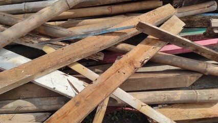 Piles of wooden beam debris and bamboo resulting from the demolition of wild traders in the Cicalengka area, Indonesia